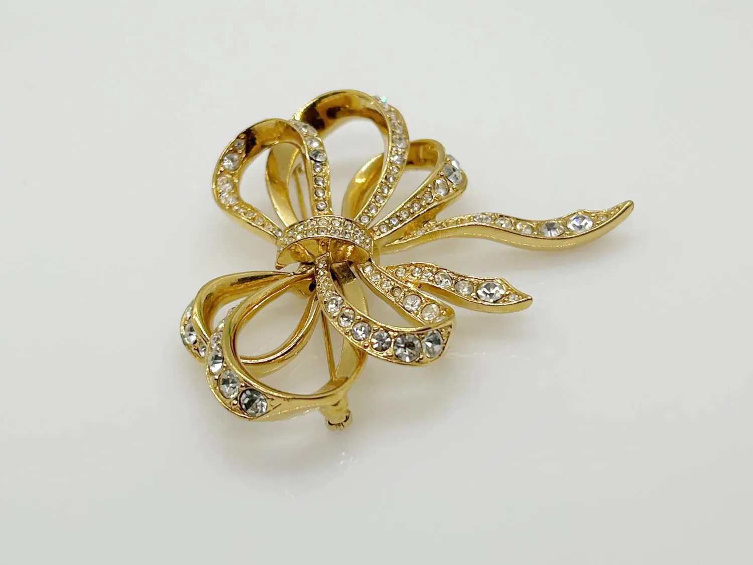 Vintage Flowing Rhinestone Ribbon Bow Brooch by Kenneth Jay Lane for Avon